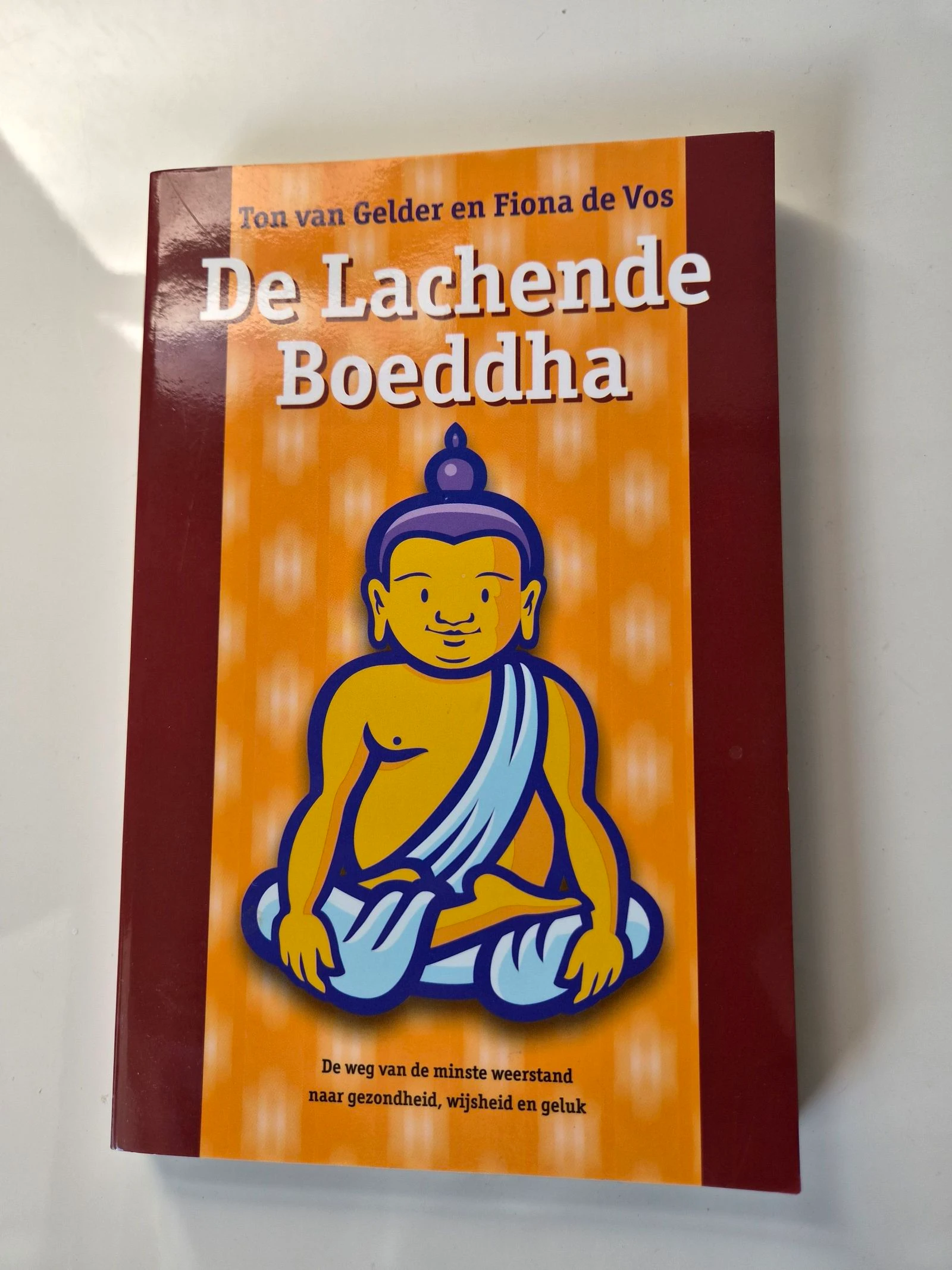 Het Boek De lachende Boeddha-Nieuw